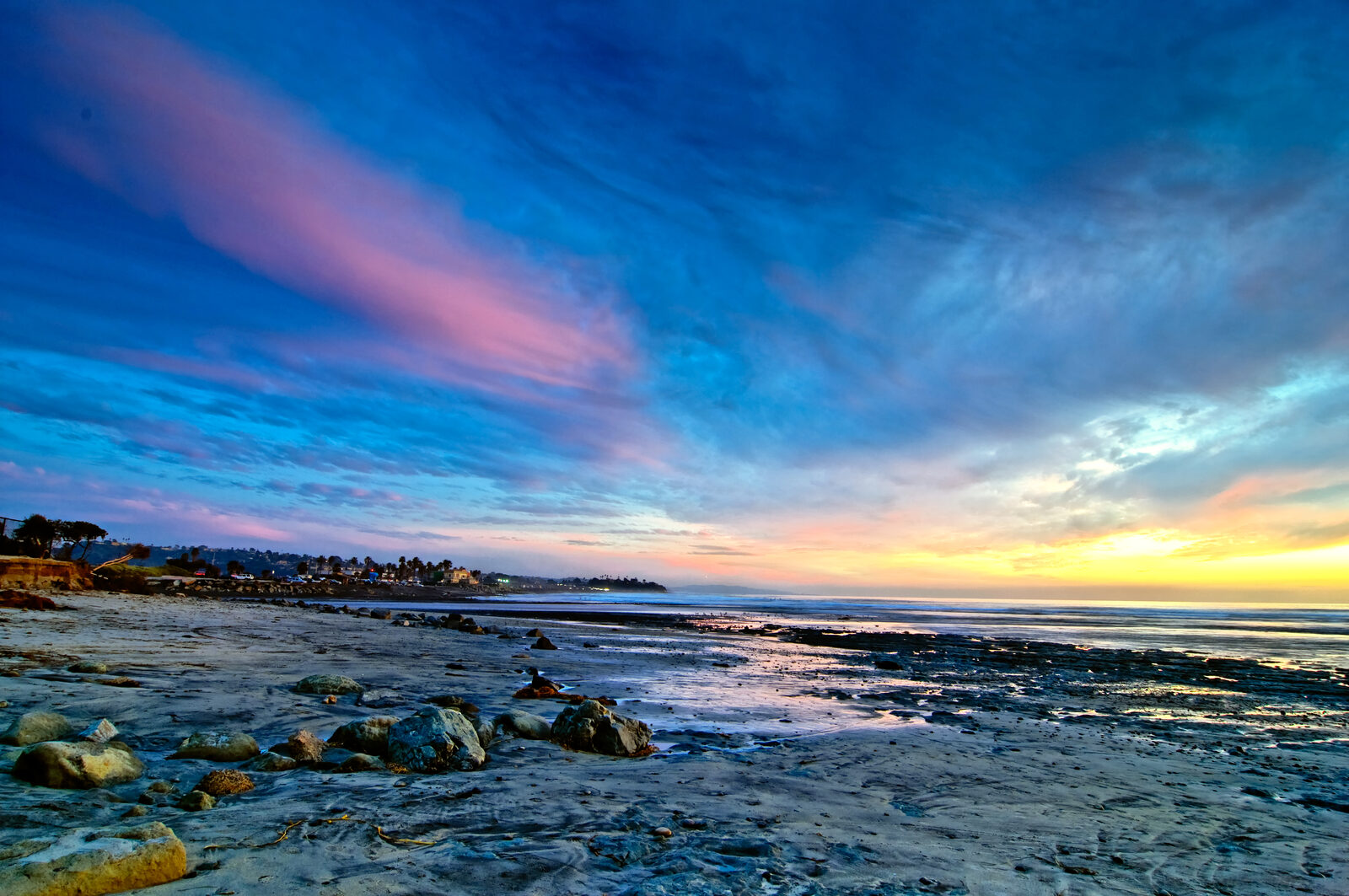 Cardiff State Beach shoreline with waves and coastal cliffs